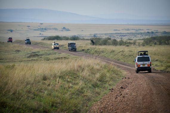Captivating view of a safari in Serengeti with off-road vehicles